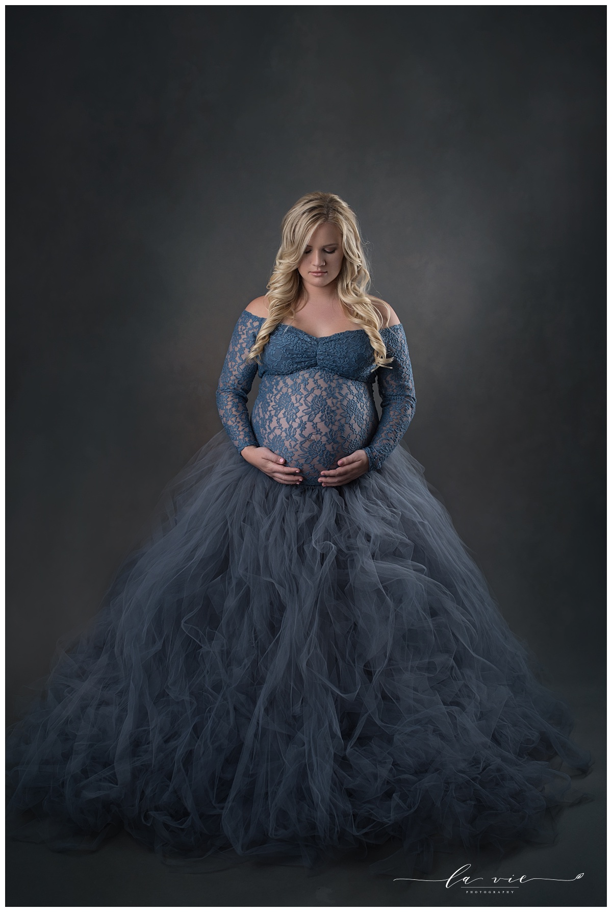 Maternity portrait with large blue tutu gown