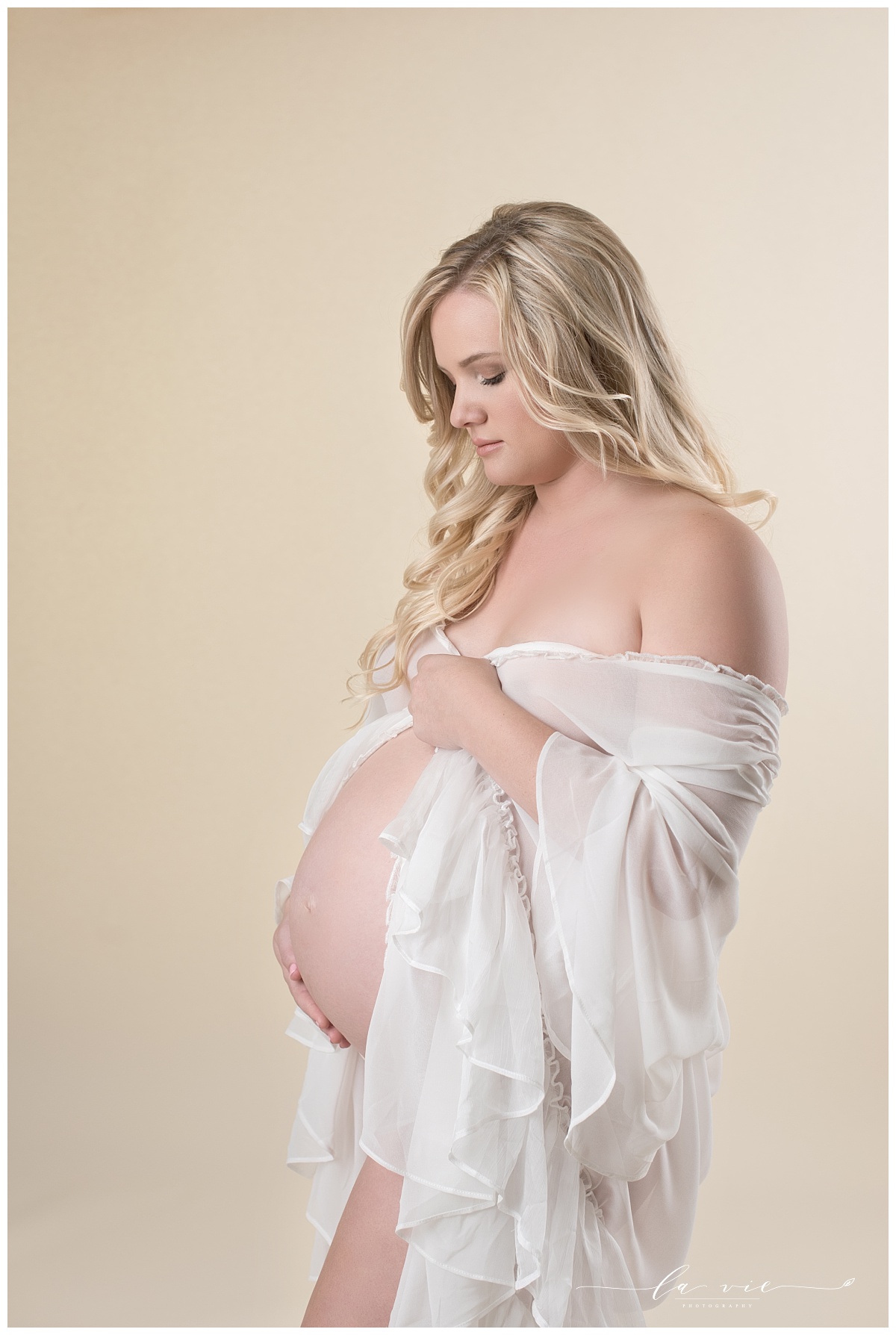maternity portrait in white sheer robe